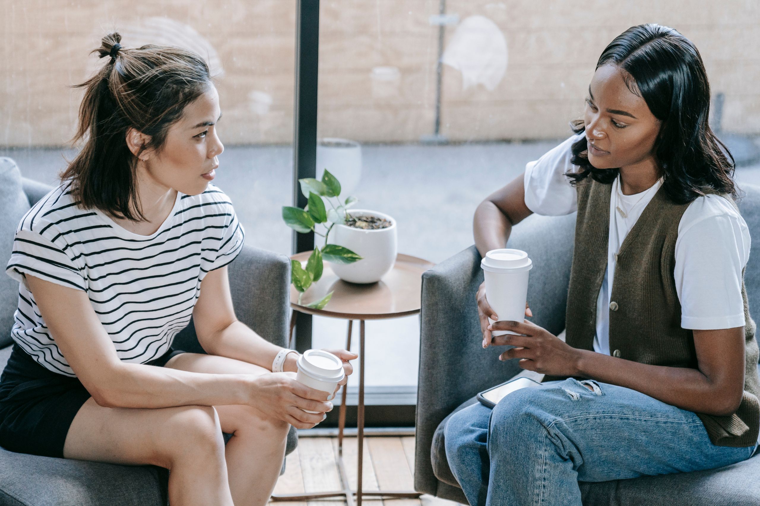 Two women having coffee and talking