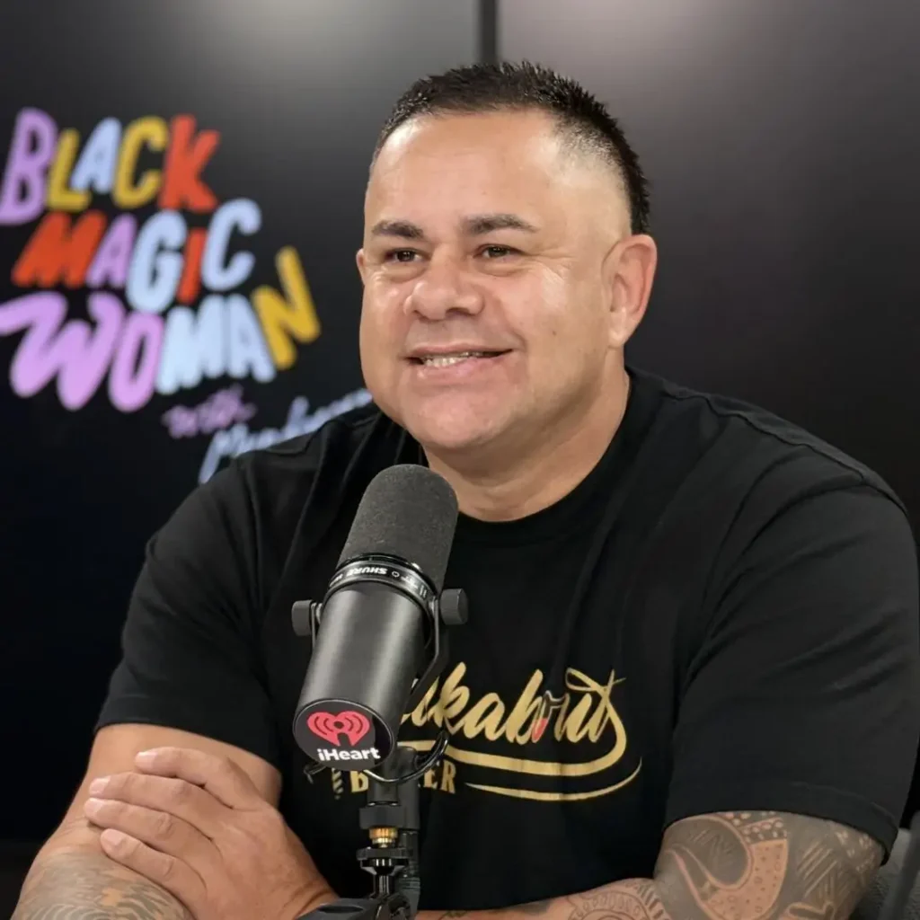 Brian Dowd sitting in the Black Magic Woman podcast studio smiling as he is interviewed for his episode on the Mental Fitness Conversations podcast.